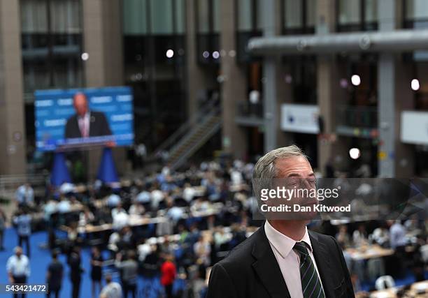 Independence Party leader Nigel Farage prepares for the media as he attends a European Council Meeting at the Council of the European Union on June...