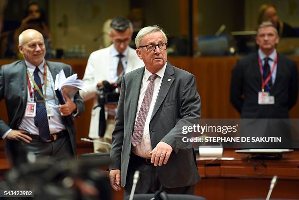 European Commission President Jean Claude Juncker looks on as he walks during EU - Summit at the EU headquarters in Brussels on June 28, 2016. Prime...