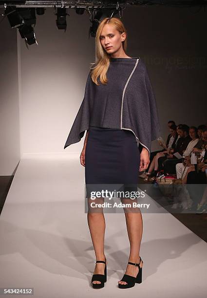 Model walks the runway at the Green Showroom show during the Mercedes-Benz Fashion Week Berlin Spring/Summer 2017 at Postbahnhof on June 28, 2016 in...