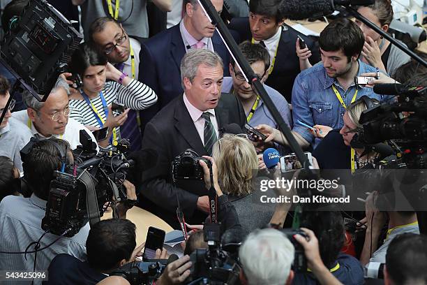 Independence Party leader Nigel Farage speaks to the media as he attends a European Council Meeting at the Council of the European Union on June 28,...
