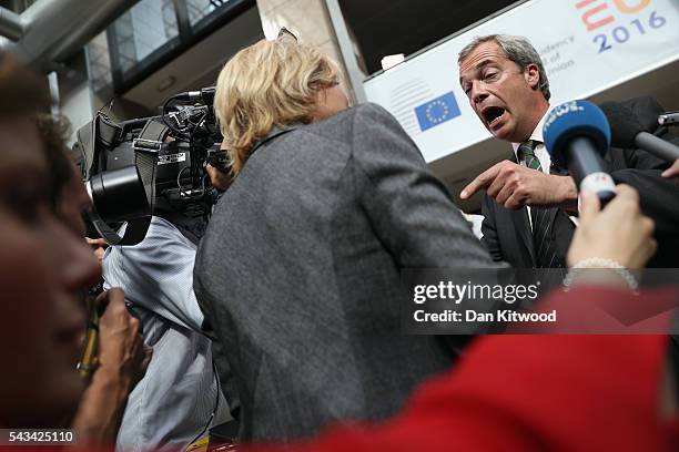 Independence Party leader Nigel Farage speaks to the media as he attends a European Council Meeting at the Council of the European Union on June 28,...