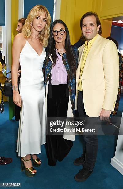 Sabine Getty, Demi Moore and Joseph Getty attend a drinks reception and dinner in celebration of the Sabine Getty Showroom in Berkeley Square on June...