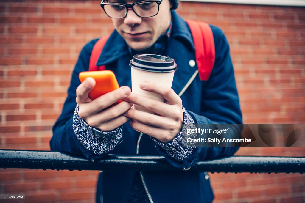 Teenage boy using a smart phone