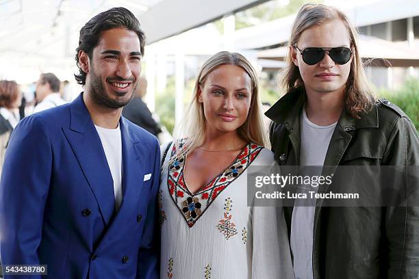 Umut Kekilli, guest and Wilson Gonzalez Ochsenknecht attend the Riani show during the Mercedes-Benz Fashion Week Berlin Spring/Summer 2017 at Erika...