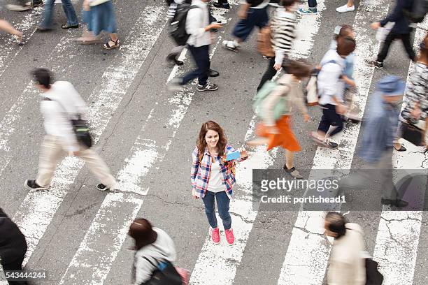 young woman making selfie on walkway in kyoto, japan - crowd of people from above stock pictures, royalty-free photos & images