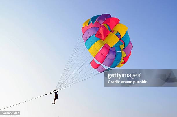 parasailing at nagoa beach, diu, india - parasailing stock pictures, royalty-free photos & images