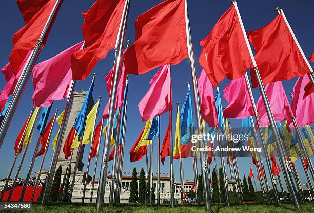 Flags flutter as Chinese people pay respects at the Monument to the People's Heroes during a memorial ceremony at Tiananmen Square on September 3,...