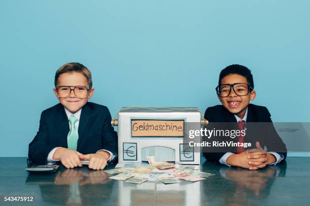 german business boys make euros with homemade money machine - vintage funny black and white stock pictures, royalty-free photos & images