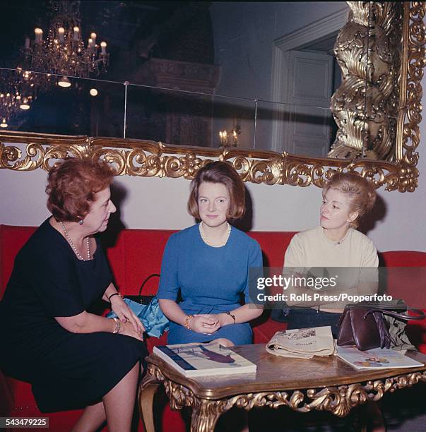 Princess Irene of the Netherlands pictured in centre wearing a blue dress, attends a fashion show in Madrid, Spain in February 1964.