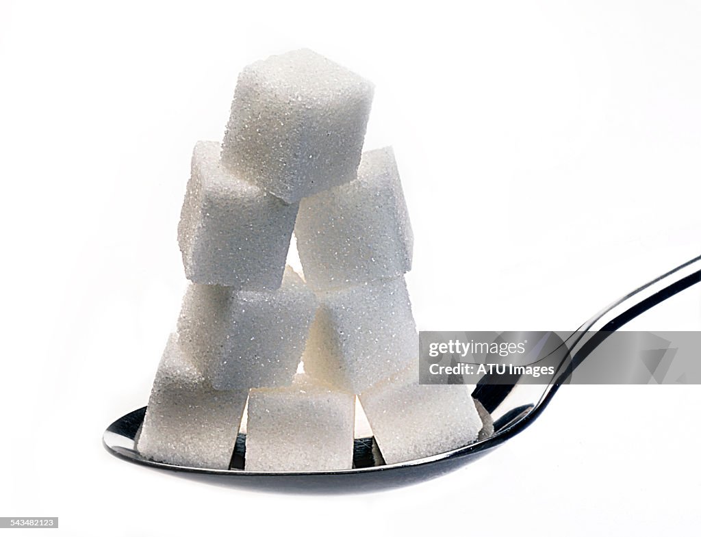 Sugar on silver spoon