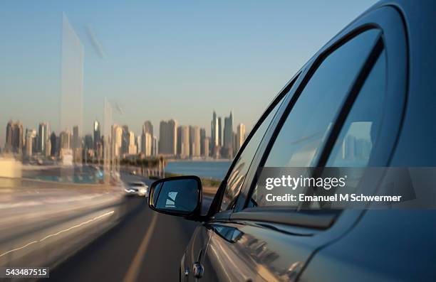 on board a driving car - car's side in foreground - car side view mirror stock pictures, royalty-free photos & images