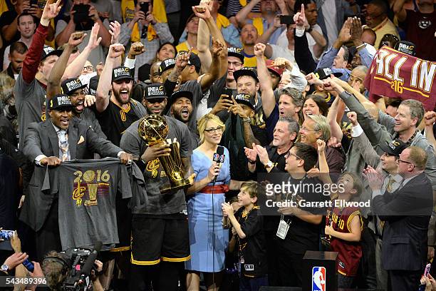 LeBron James of the Cleveland Cavaliers celebrates with his team and the Larry O'Brien NBA Championship Trophy after winning Game Seven of the 2016...