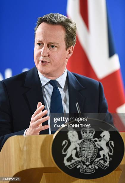 British Prime minister David Cameron gestures as he delivers a speech during a press conference during an European Union summit on June 28, 2016 at...