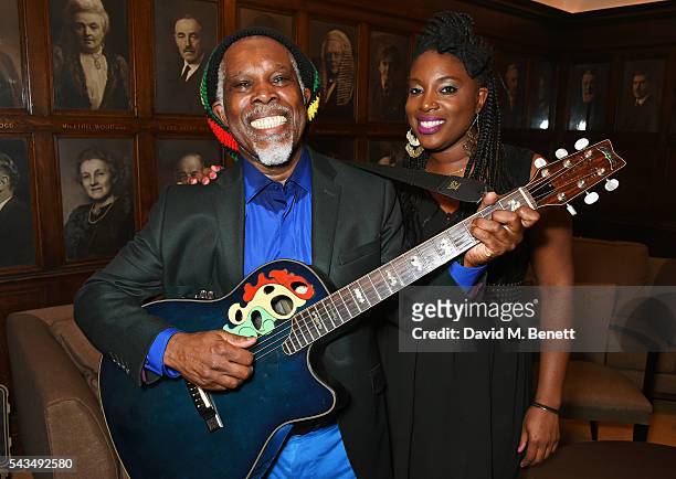Billy Ocean poses backstage with his daughter Cherie Charles following his performance at the Regent Street Polytechnic 125th Anniversary gala at the...