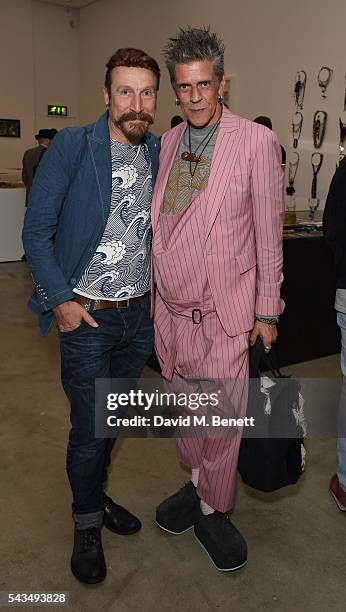 Guest and Judy Blame attend a VIP private view of "Judy Blame: Never Again" and "Artistic Difference" at the ICA on June 28, 2016 in London, England.