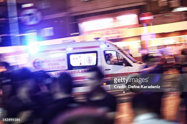 Ambulances arrives as relatives of the Ataturk Airport suicide bomb attack victims wait outside Bakirkoy Sadi Konuk Hospital, in the early hours of...