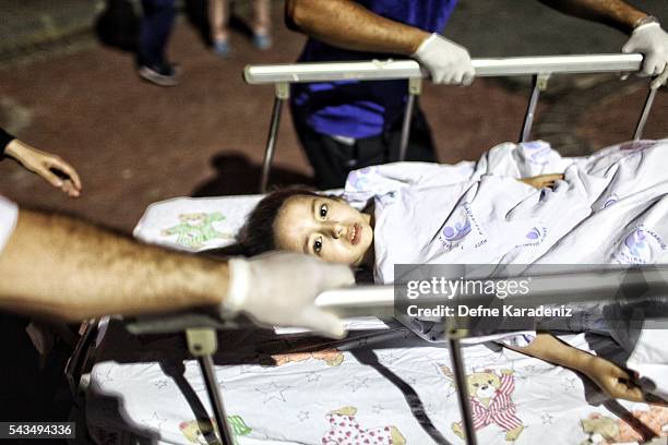 Wounded girl from the Ataturk Airport suicide bomb attack is carried to the Bakirkoy Sadi Konuk Hospital, in the early hours of June 29, 2016 in...