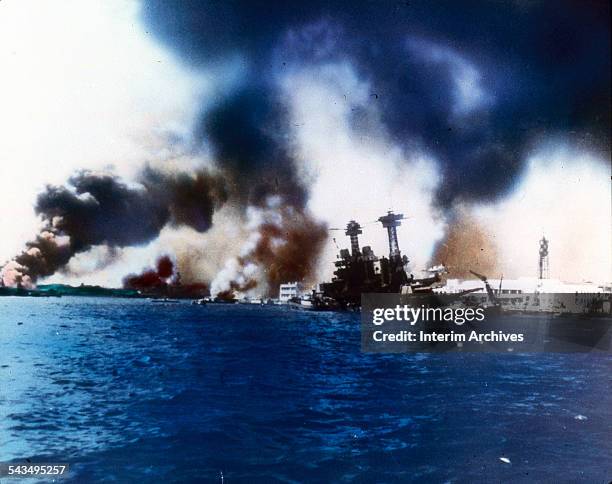 The battleship USS California sinks near Ford Island after the Japanese bombed and torpedoed the ship during the attack on Pearl Harbor, Honolulu,...