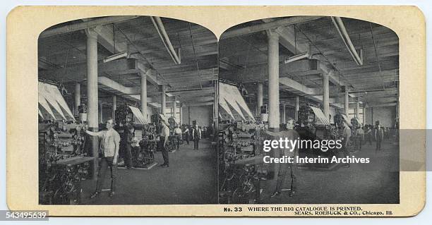 Stereoscopic view illustrating the press room in the Printing Building at Sears in Chicago, Illinois, circa 1900s. These presses deliver five...