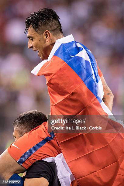 Chile defender Gonzalo Jara draped in the Chilean flag after winning the match during the Copa America Centenario FINAL Argentina vs Chile Soccer,...