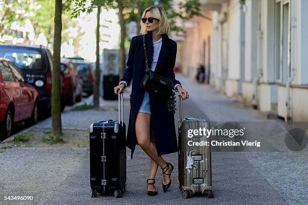 Lisa Hahnbueck travelling with Rimowa suitcase during the Mercedes-Benz Fashion Week Berlin Spring/Summer 2017 on June 28, 2016 in Berlin, Germany.