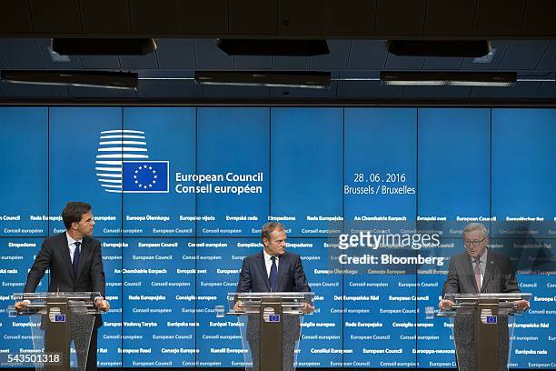 Jean-Claude Juncker, president of the European Commission, right, speaks during a news conference with Donald Tusk, president of the European Union ,...