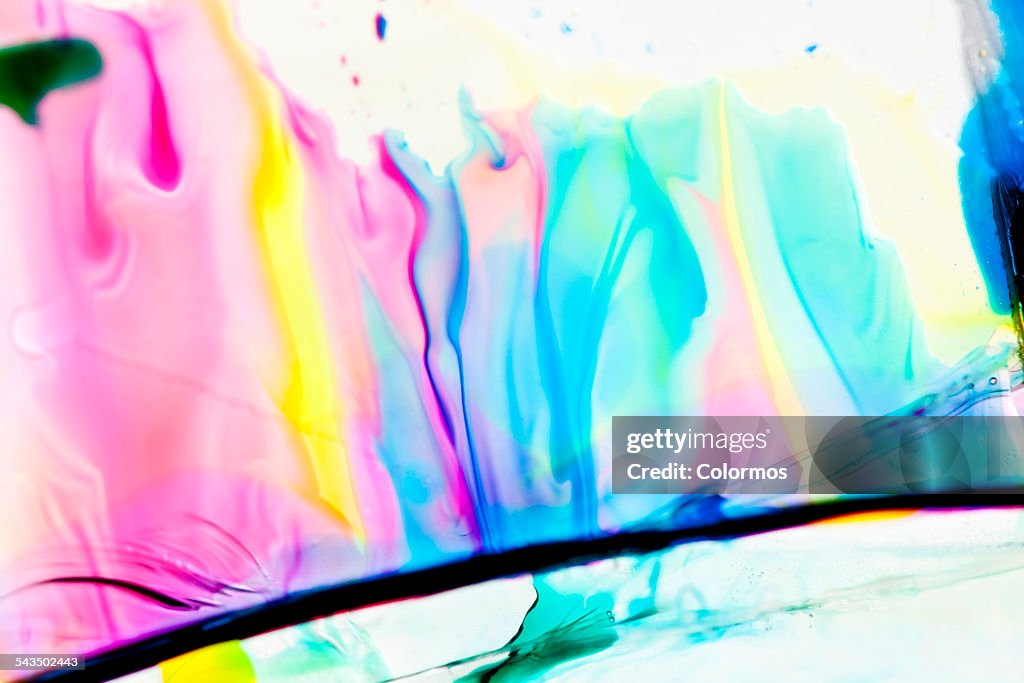 Colorful liquid on glass, close-up