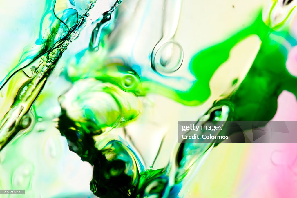 Colorful liquid on glass, close-up