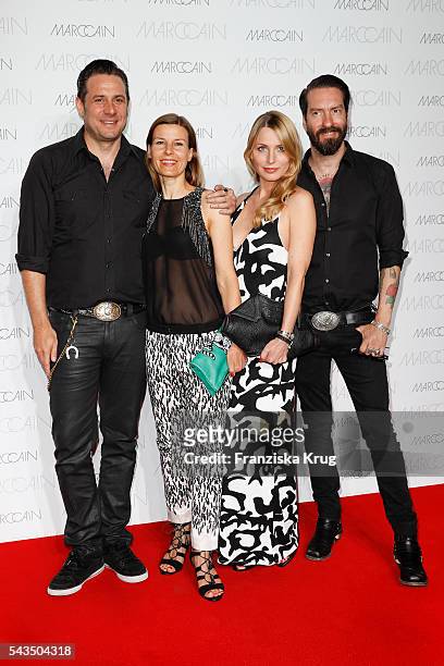 Sascha Vollmer , his partner Jenny, Alec Voelkel and his wife Johanna Michels attend the Marc Cain fashion show spring/summer 2017 at CITY CUBE...