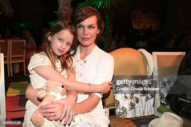 Milla Jovovich and her daughter Ever Gabo Anderson during the Marc Cain fashion show spring/summer 2017 at CITY CUBE Panorama Bar on June 28, 2016 in...