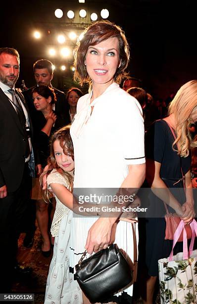 Milla Jovovich and her daughter Ever Gabo Anderson during the Marc Cain fashion show spring/summer 2017 at CITY CUBE Panorama Bar on June 28, 2016 in...