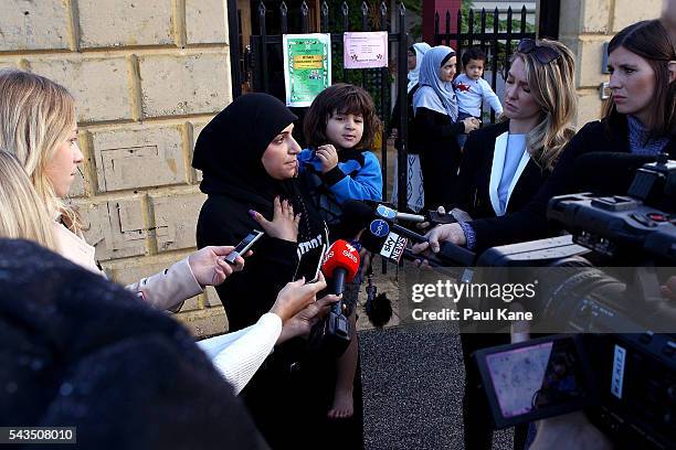 Zahra Alasadi talks with reporters outside the Thornlie Australian Islamic College and Mosque on June 29, 2016 in Perth, Australia. Police are...