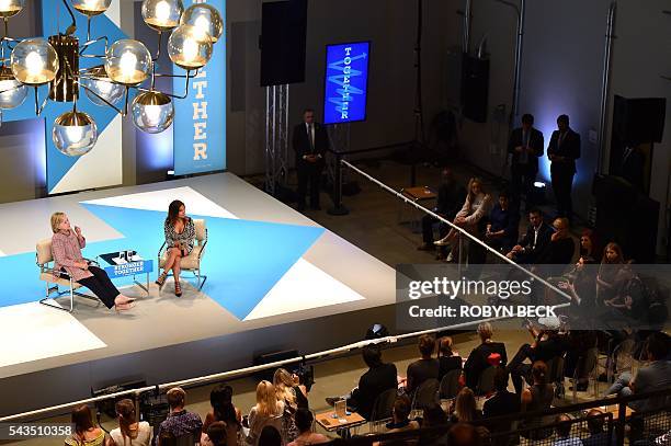 Presumptive Democratic presidential nominee Hillary Clinton and moderator Dulce Candy listen as YouTube celebrity Chrissy Chambers asks Clinton how...