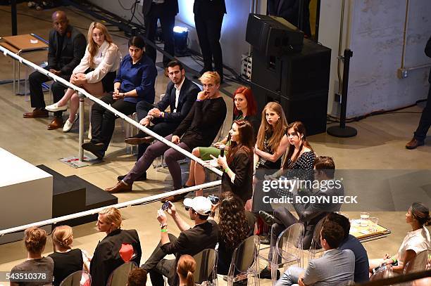 Attendees look on as YouTube celebrity Chrissy Chambers asks presumptive Democratic presidential nominee Hillary Clinton how she will help stop...