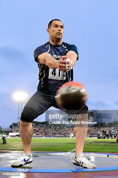 Koji Murofushi competes in the Men's Hammer Throw qualification during day one of the 100th Japan National Athletic Championships at the Paroma...