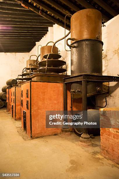Old distilling equipment for brandy cognac production in Gonzalez Byass bodega, Jerez de la Frontera, Cadiz province, Spain.