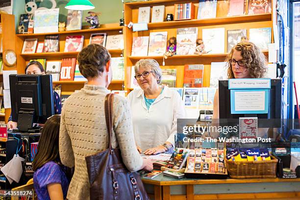 Malaprop's Bookstore/Cafe Owner Emöke B'Rácz assists a customer inside Malaprop's in Asheville, North Carolina on June 21, 2016. Malaprop's has had...