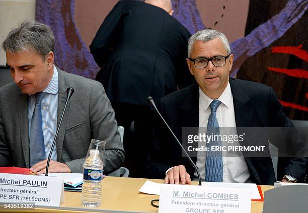 Telecom Company Altice N.V group CEO and CEO of SFR Michel Combes and CEO of SFR group in charge of Telecoms activities Michel Paulin attend their...