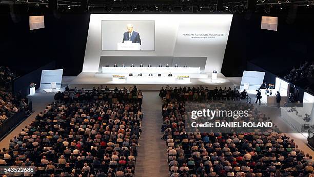 Hans Dieter Poetsch, CEO of German company Porsche SE addresses the audience during the company's annual shareholder meeting in Stuttgart, on June...