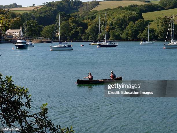 Canoeists on the River Yealm, Devon, UK.