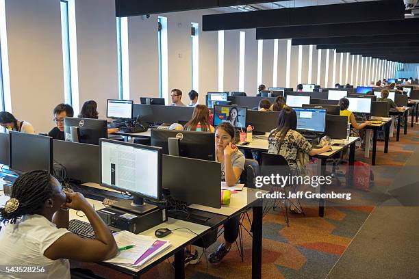 Australia, Sydney, University of Sydney education campus student Fisher Library Black girl woman teen Asian computer stations screen monitor lab...