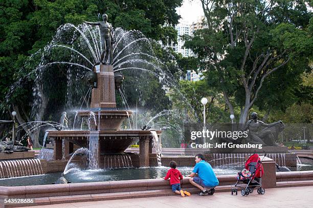 Australia, Sydney, Hyde Park Archibald Fountain man father boy son.