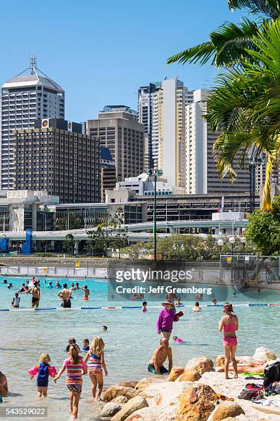 Australia, Queensland, Brisbane, Southbank Parklands Streets Beach sunbathers sand water Central Business District CBD city skyline skyscrapers...