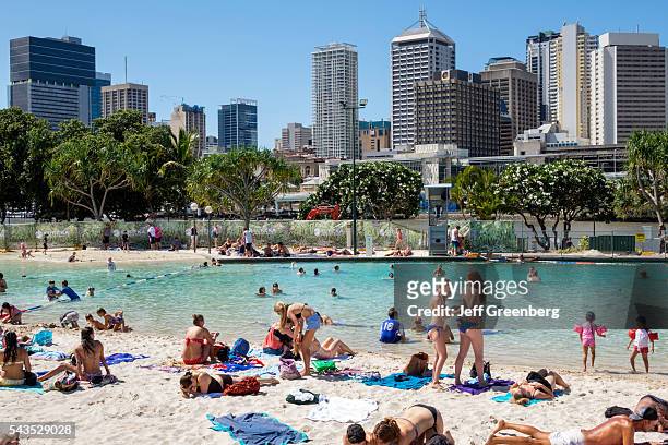 Australia, Queensland, Brisbane, Southbank Parklands Streets Beach sunbathers sand water Central Business District CBD city skyline skyscrapers...