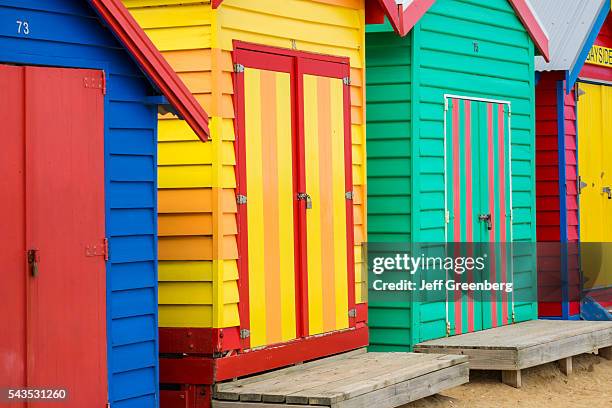 Australia, Victoria Melbourne Brighton Beach bathing boxes huts cabins colorful.