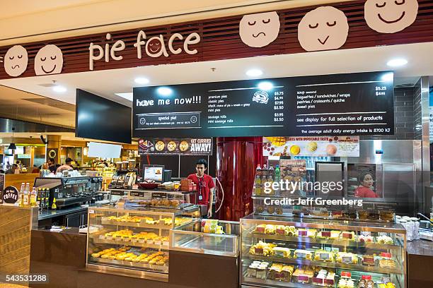 Australia, Sydney, Kingsford-Smith Airport SYD inside interior terminal concourse gate area Pie Face counter concession meat pies sale display.