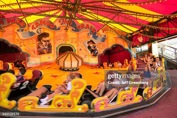 Australia, Sydney, Milsons Point Luna Park amusement thrill ride student class field trip classmates having fun carnival motion centrifugal force...