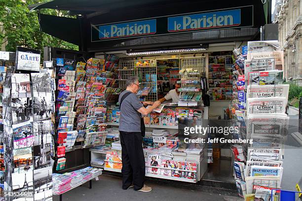 France Europe French Paris 4th arrondissement Rue de Rivoli newsstand newspapers magazines sale.