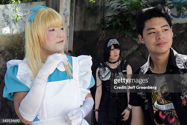 Japan Tokyo Harajuku Asian man cosplay costume play cross dresser dressed like female blonde wig man.