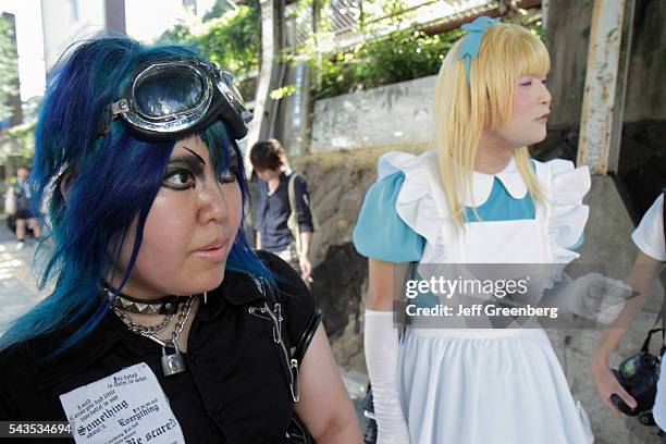 Japan Tokyo Harajuku Asian man cosplay costume play cross dresser dressed like female blonde wig woman blue hair dyed.